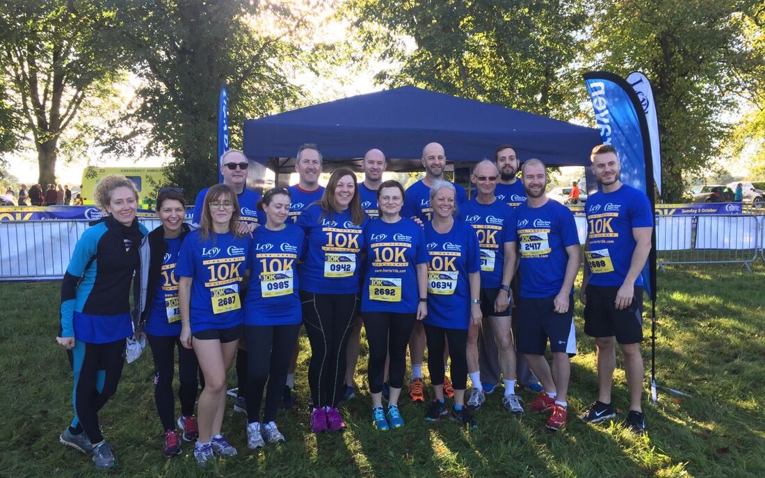 Plowman Craven staff taking Gold at the Herts 10k